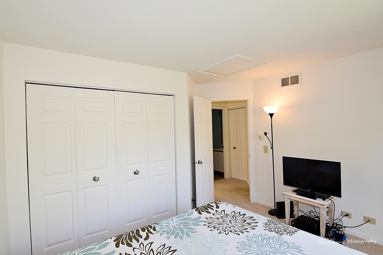 625 Cobblestone Court Elgin, IL 60120 - Photo 12 of 15 a view of a bedroom with a flat screen tv and a refrigerator