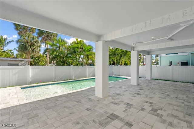 a view of a brick house with a yard