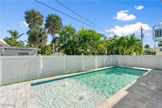 a view of a back yard of the house