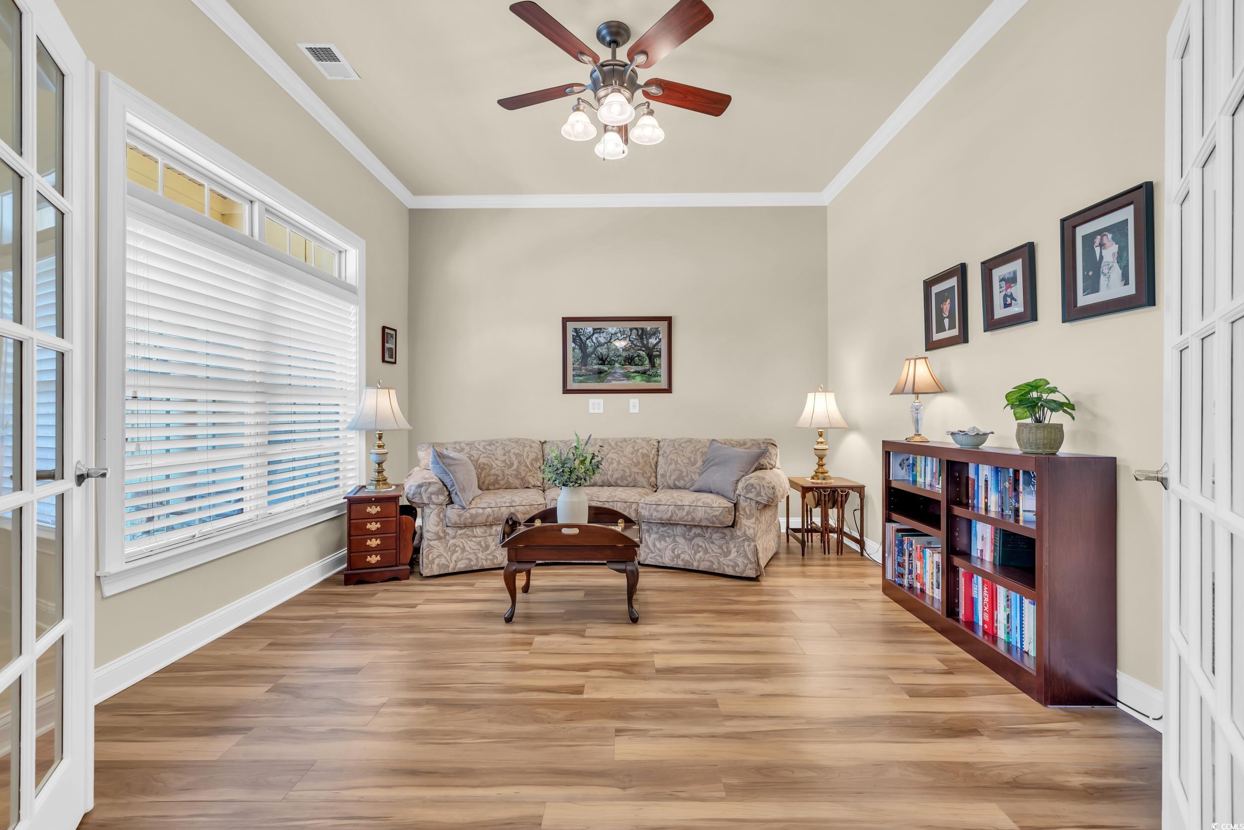 4254 Congressional Drive Myrtle Beach, SC 29579 - Photo 13 of 40 Office/Flex room featuring crown molding, LVP floors, and a ceiling fan