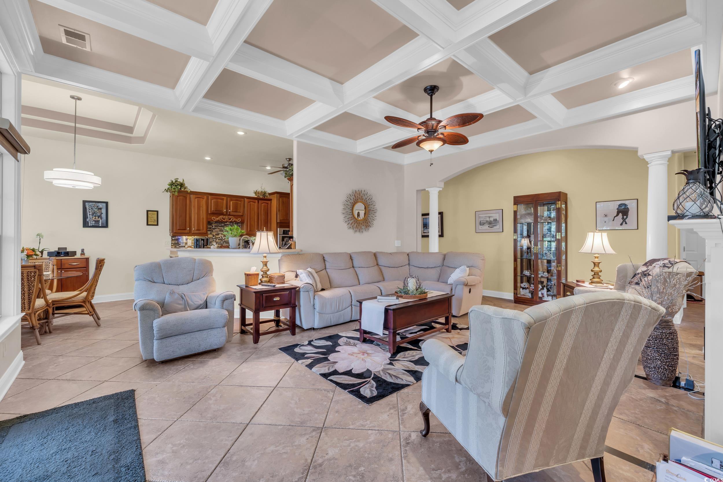 4254 Congressional Drive Myrtle Beach, SC 29579 - Photo 15 of 40 Living area with a ceiling fan, ornate columns, coffered ceiling, and tile flooring