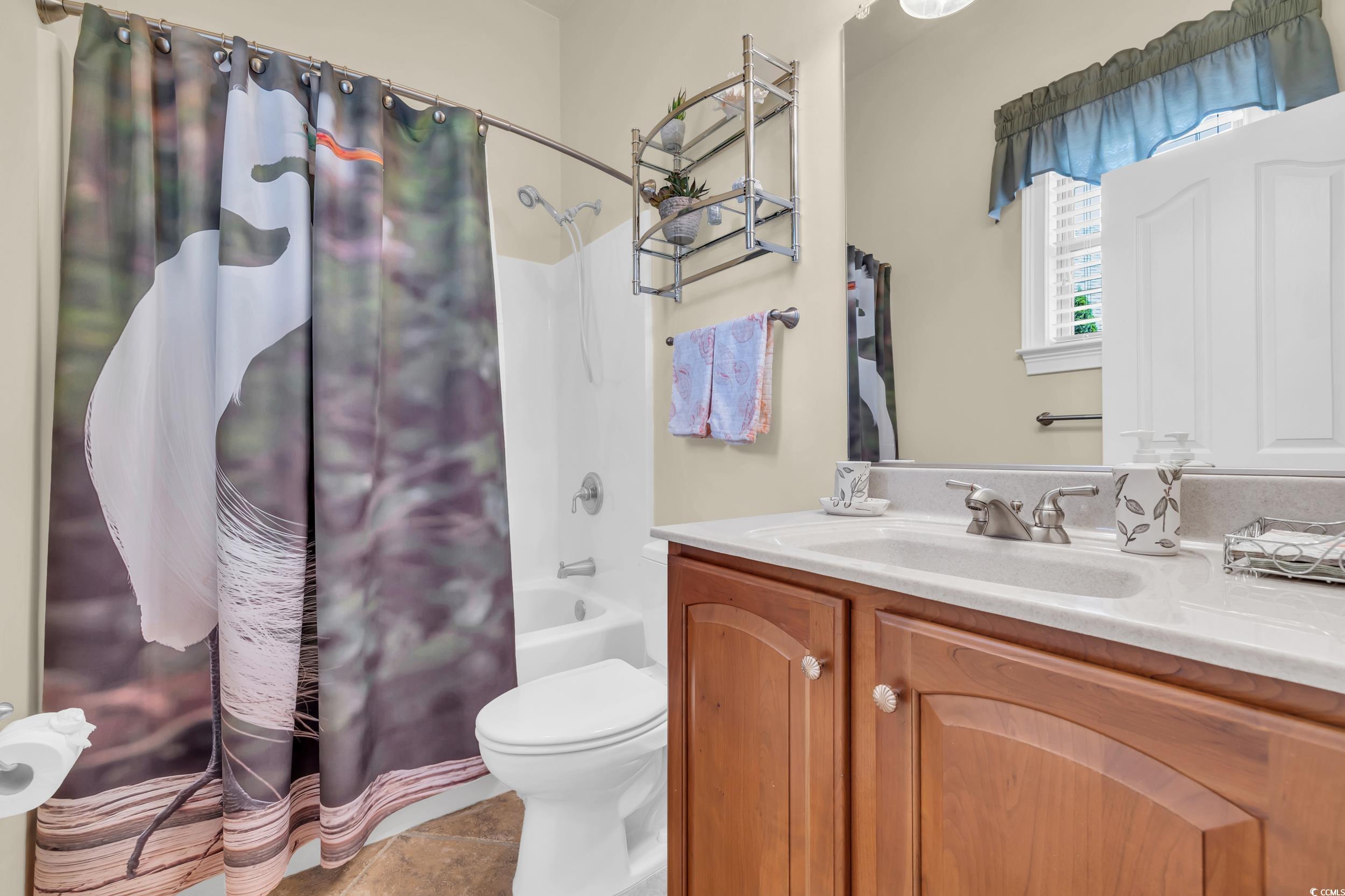 4254 Congressional Drive Myrtle Beach, SC 29579 - Photo 26 of 40 Full bath with shower / bath combo, vanity, and tile flooring