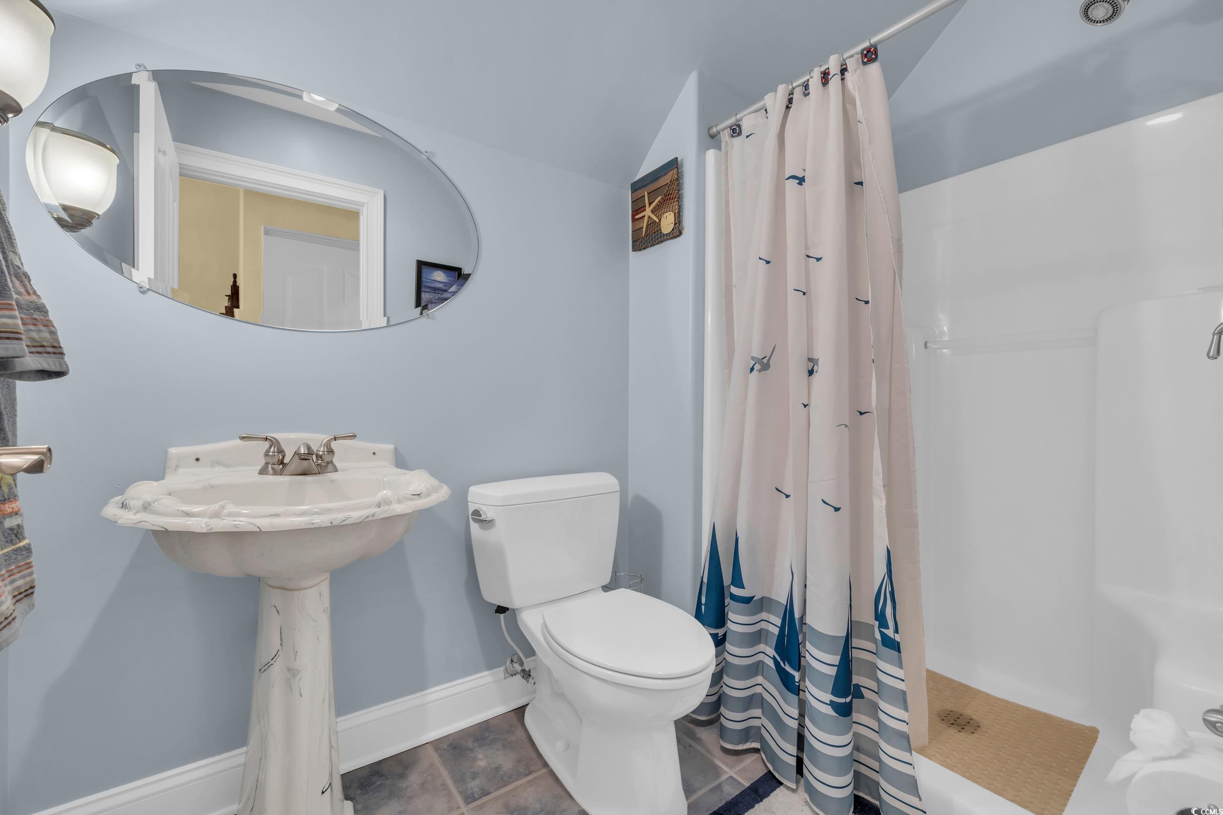 4254 Congressional Drive Myrtle Beach, SC 29579 - Photo 30 of 40 2nd level bathroom with a shower stall and pedestal sink