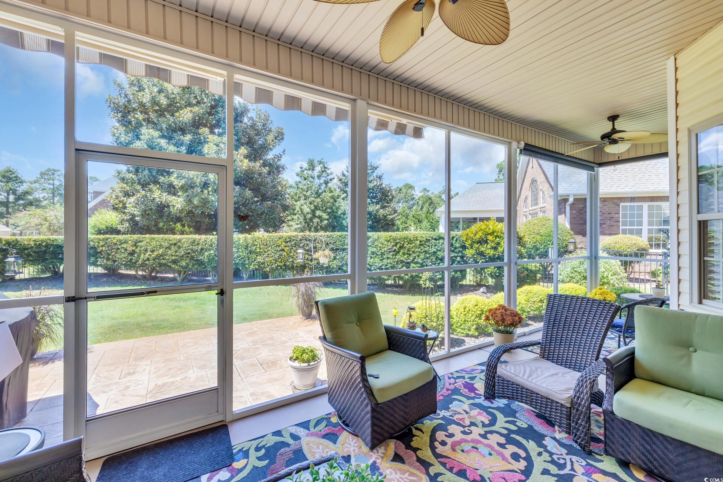 4254 Congressional Drive Myrtle Beach, SC 29579 - Photo 31 of 40 Large screened in back porch with SunSetter awning and retractable shades.