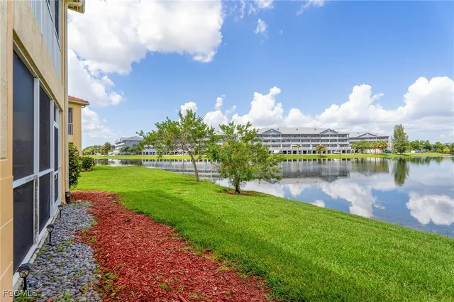 a view of a lake with a big yard