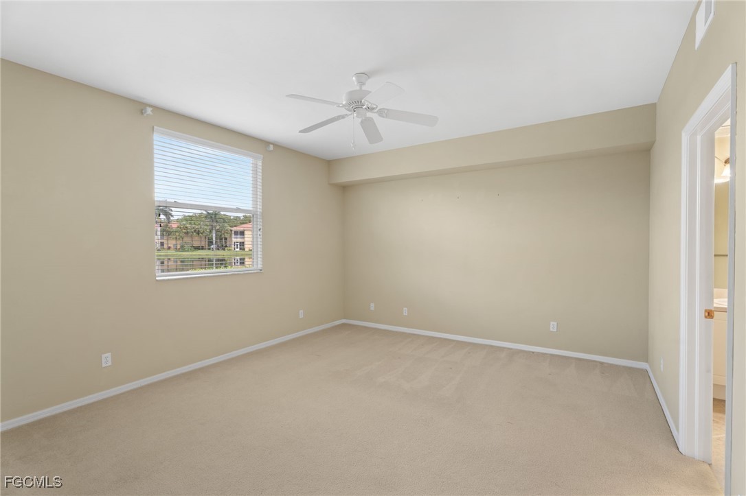 4336 Bellasol Circle, Unit 2911 Fort Myers, FL 33916 - Photo 23 of 45 an empty room with a window and a fan