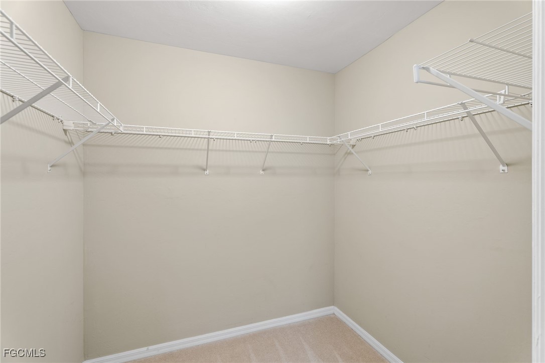 4336 Bellasol Circle, Unit 2911 Fort Myers, FL 33916 - Photo 26 of 45 a view of a room with racks on the wall