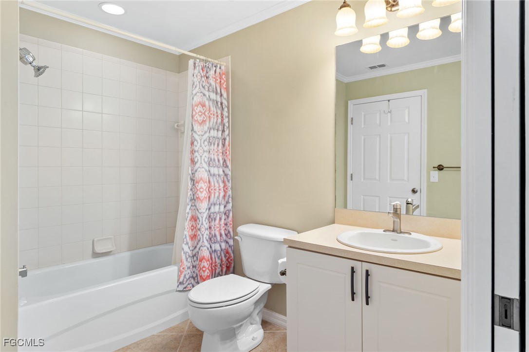 4336 Bellasol Circle, Unit 2911 Fort Myers, FL 33916 - Photo 32 of 45 a bathroom with a sink a toilet a mirror a vanity and bathtub