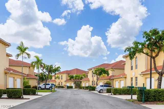 a view of a street with a building in the background