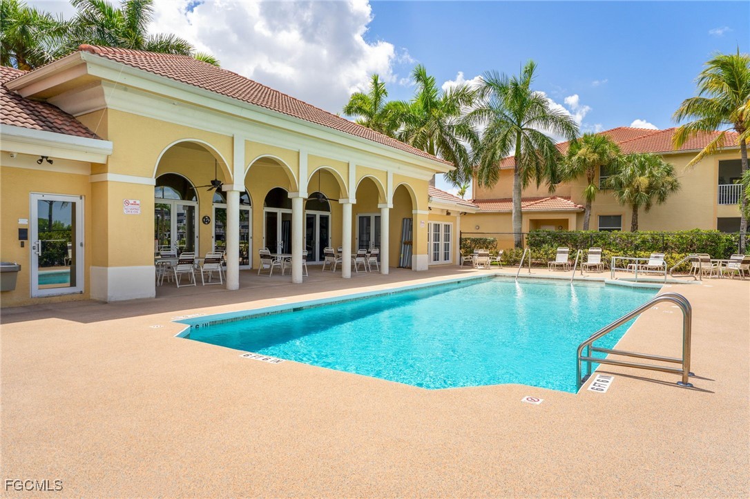 4336 Bellasol Circle, Unit 2911 Fort Myers, FL 33916 - Photo 40 of 45 a view of a building with a garden and plants