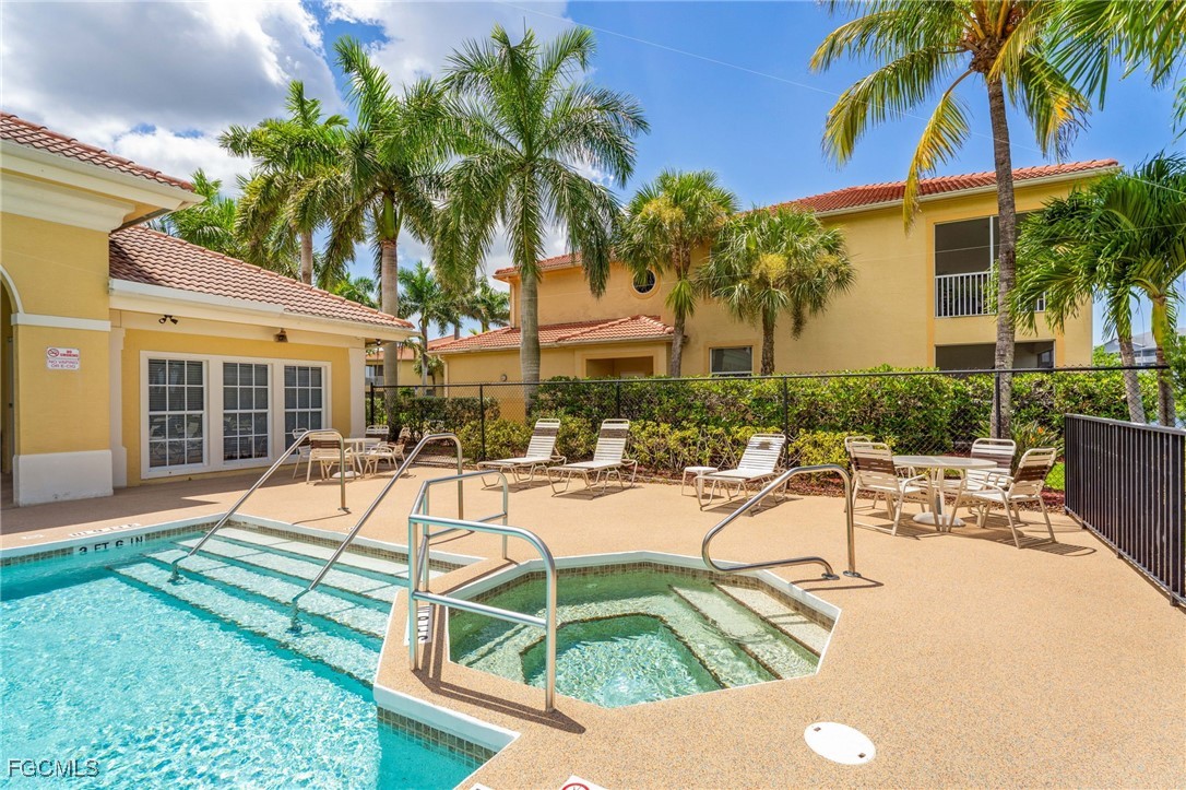 4336 Bellasol Circle, Unit 2911 Fort Myers, FL 33916 - Photo 43 of 45 a view of a house with swimming pool and sitting area