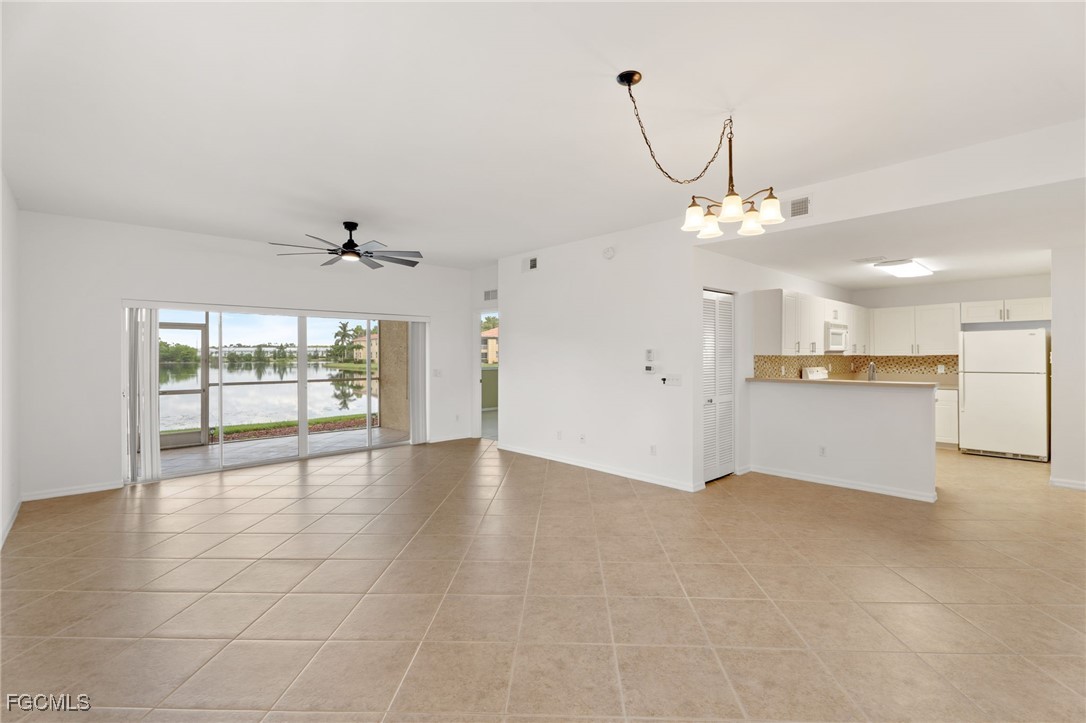 4336 Bellasol Circle, Unit 2911 Fort Myers, FL 33916 - Photo 5 of 45 a view of an empty room with a window