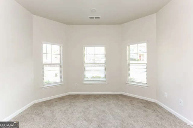 an empty room with windows