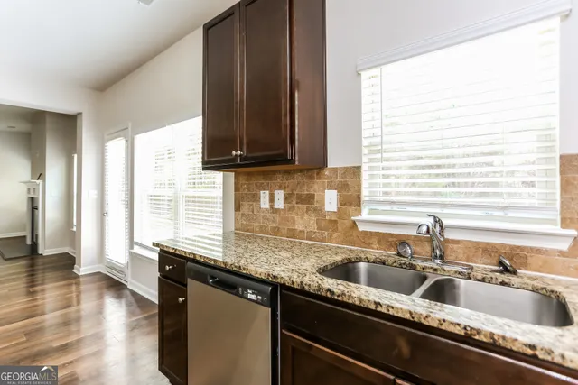 a kitchen with a sink and a window