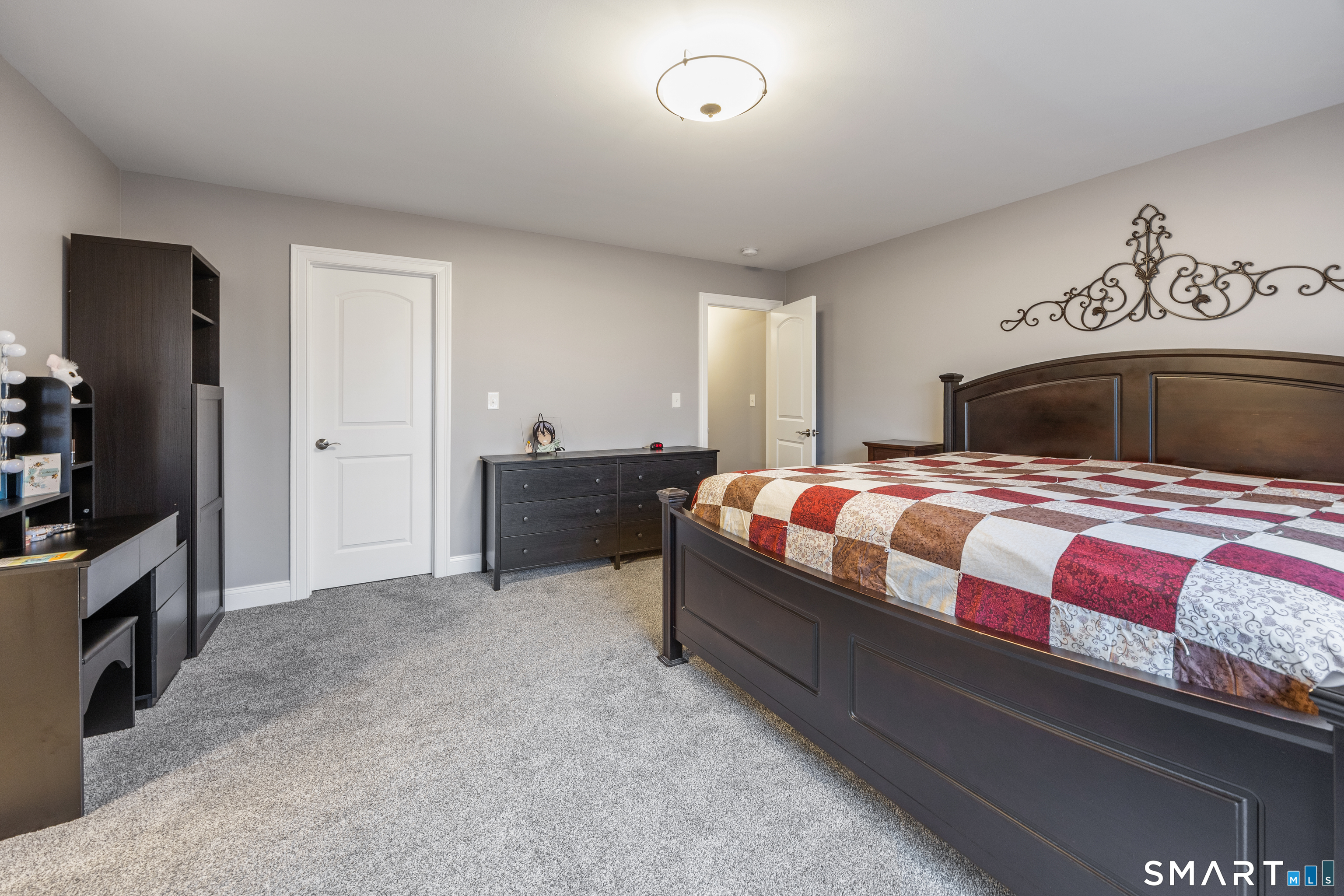 52 Brookview Circle, Unit 52 Bristol, CT 06010 - Photo 18 of 29 a bedroom with a bed and a television