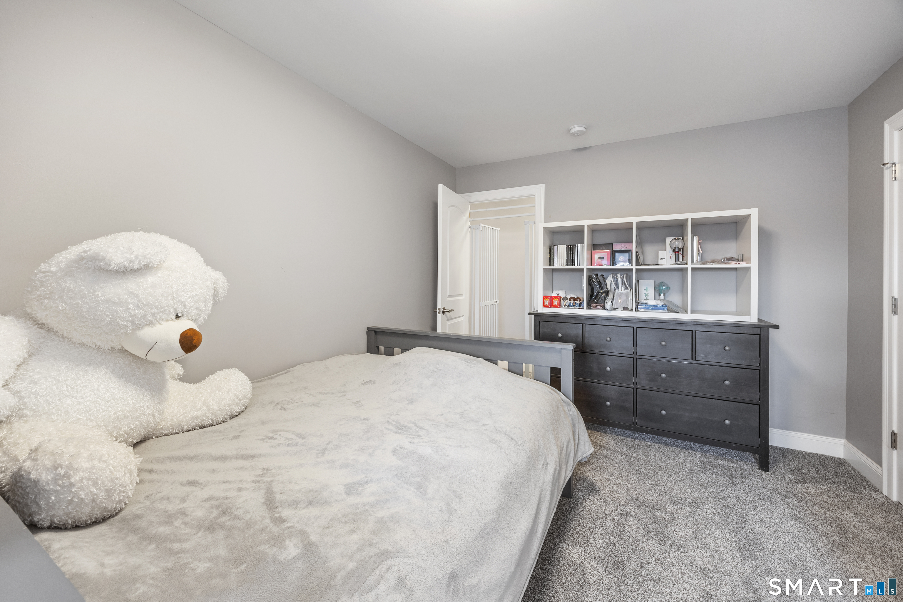 52 Brookview Circle, Unit 52 Bristol, CT 06010 - Photo 22 of 29 a bedroom with a bed and a cabinets