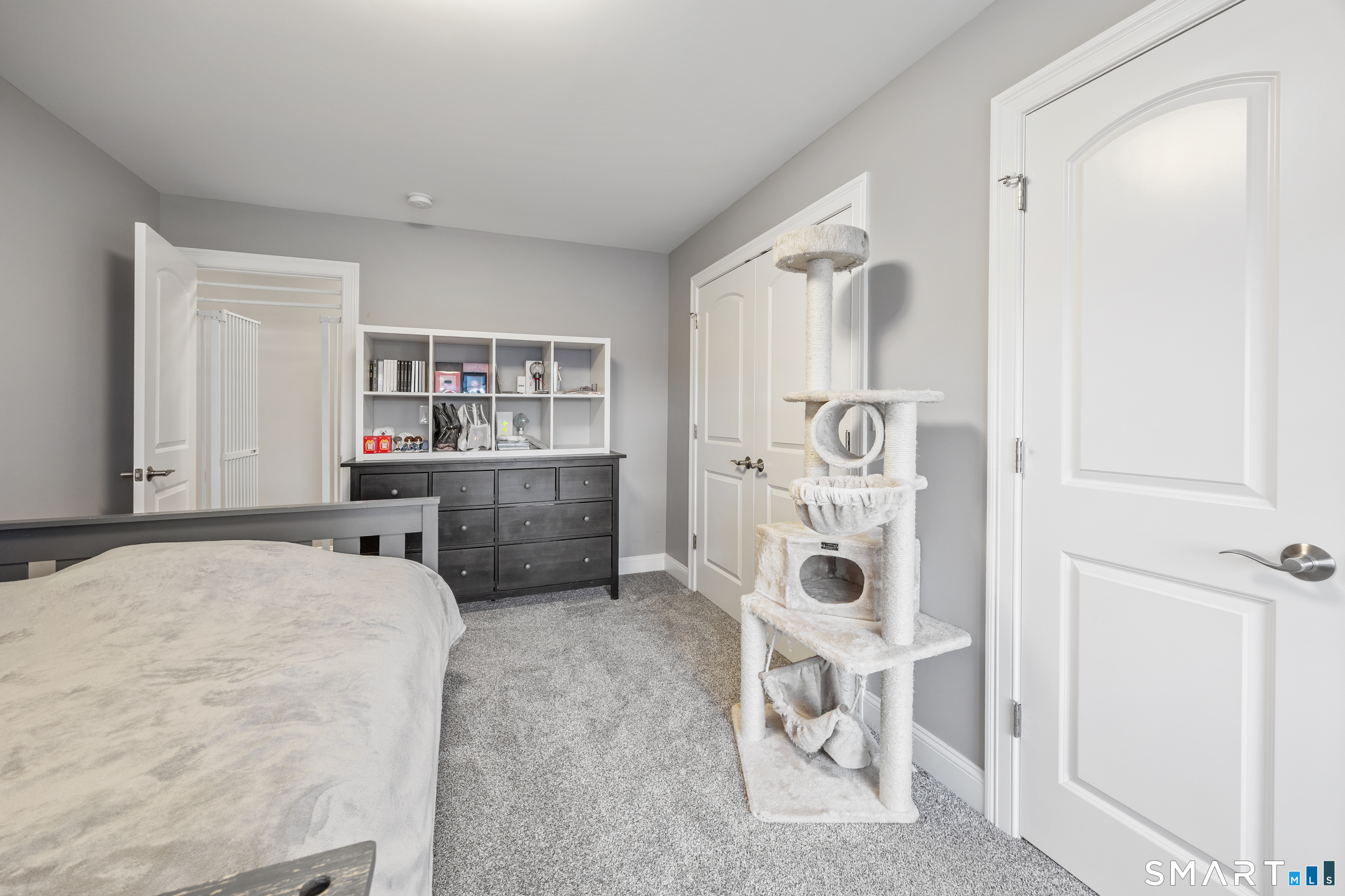 52 Brookview Circle, Unit 52 Bristol, CT 06010 - Photo 24 of 29 a bedroom with a bed and a chair