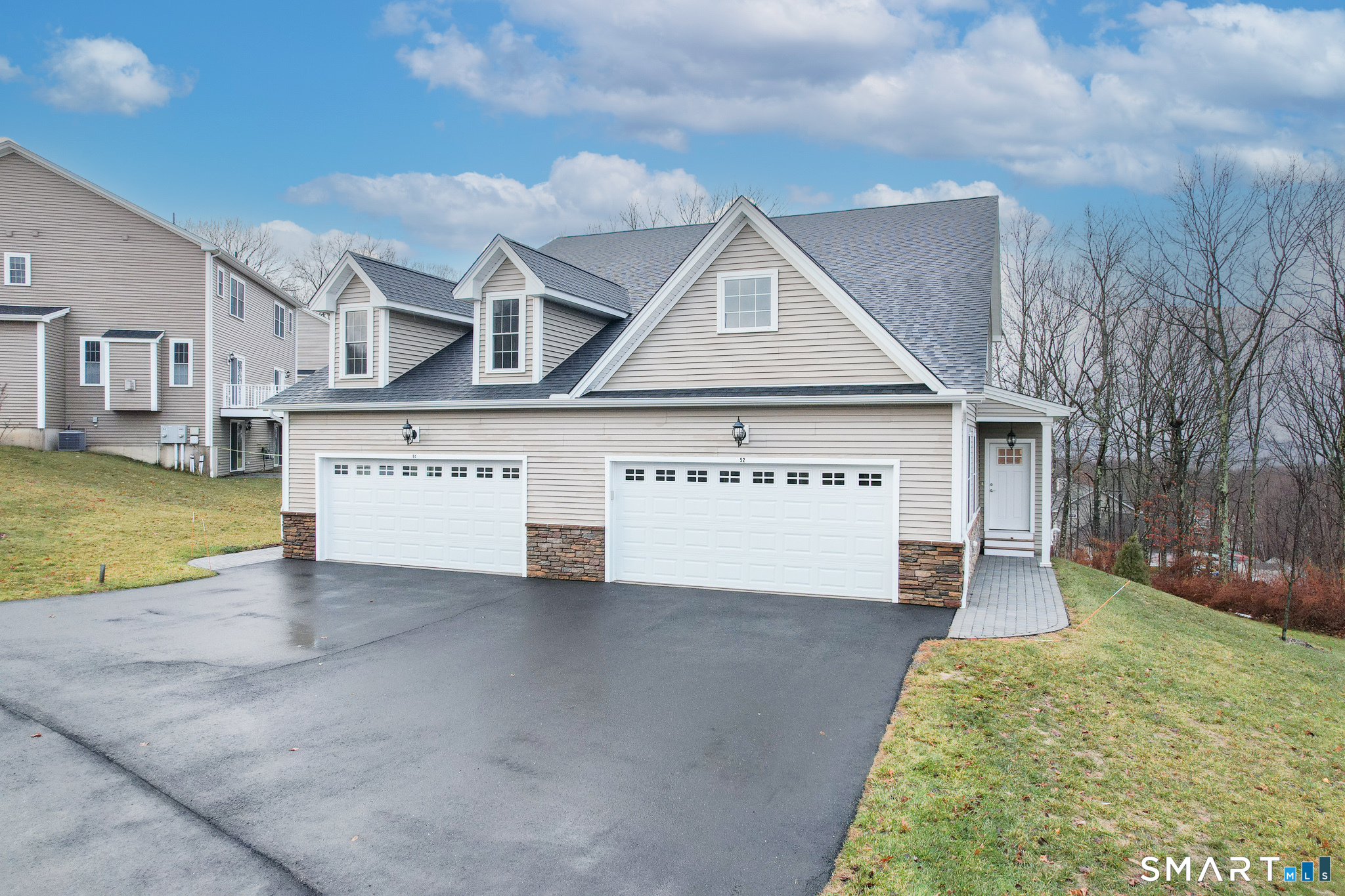 52 Brookview Circle, Unit 52 Bristol, CT 06010 - Photo 28 of 29 a view of a house with a yard and garage