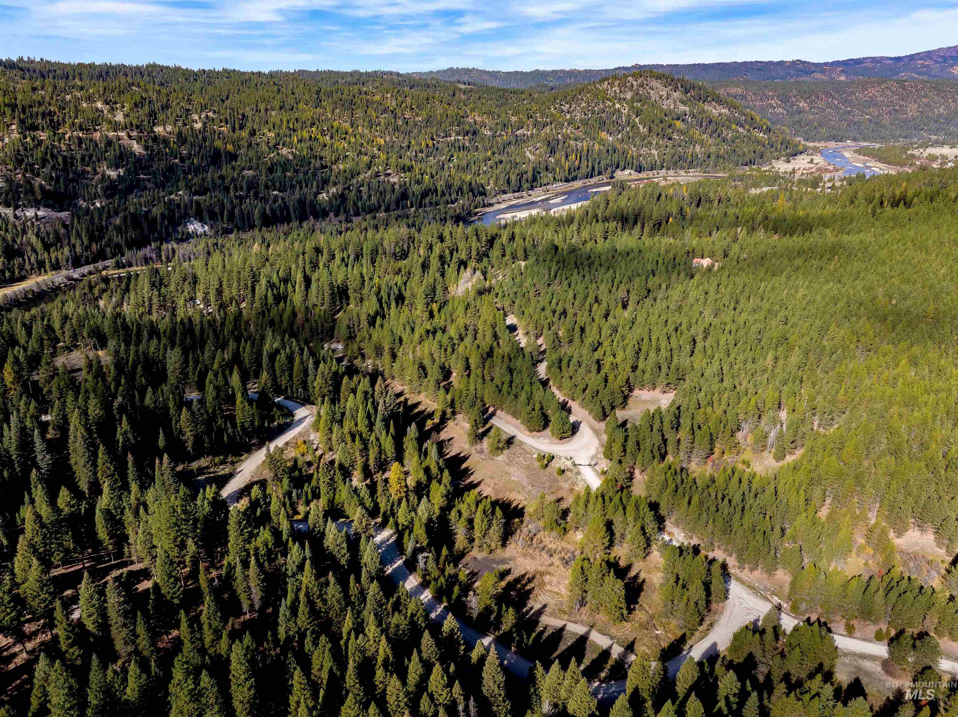 201 Tripod View Cascade, ID 83611 - Photo 14 of 41 Aerial view of property's location with a mountainous background