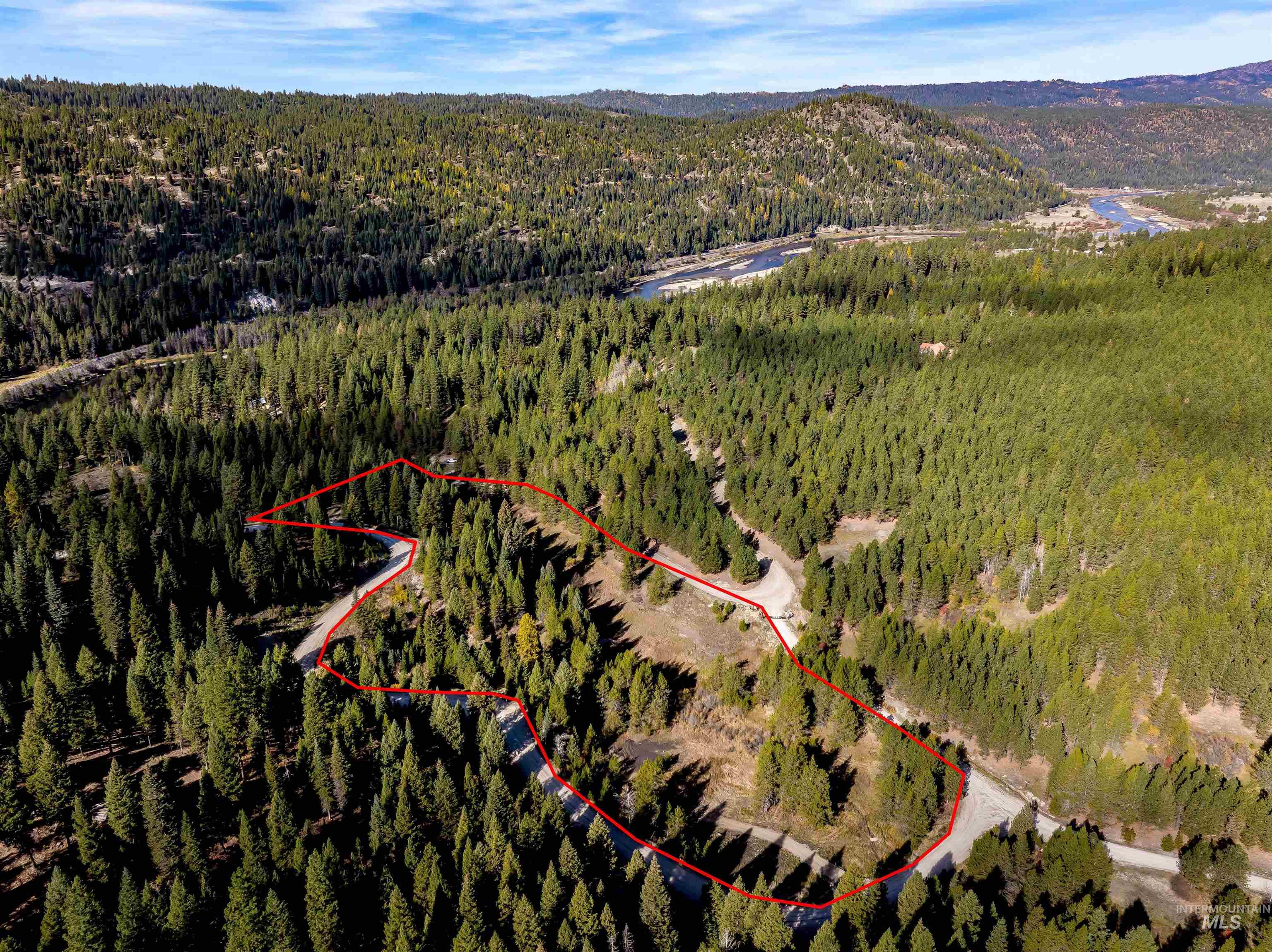 201 Tripod View Cascade, ID 83611 - Photo 15 of 41 Aerial view of property and surrounding area with property parcel outlined and a mountainous background