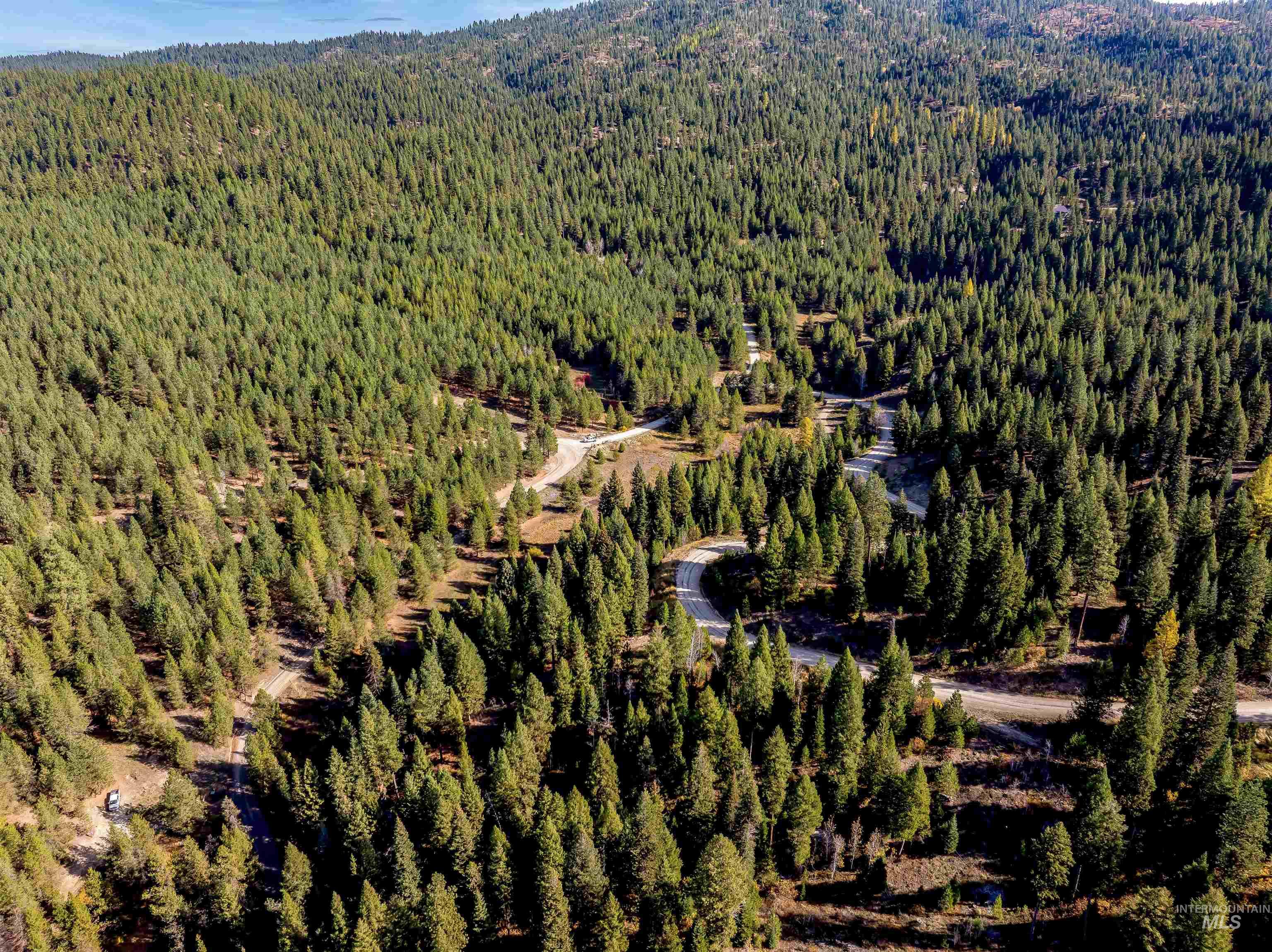 201 Tripod View Cascade, ID 83611 - Photo 28 of 41 Aerial view of property and surrounding area featuring a forest