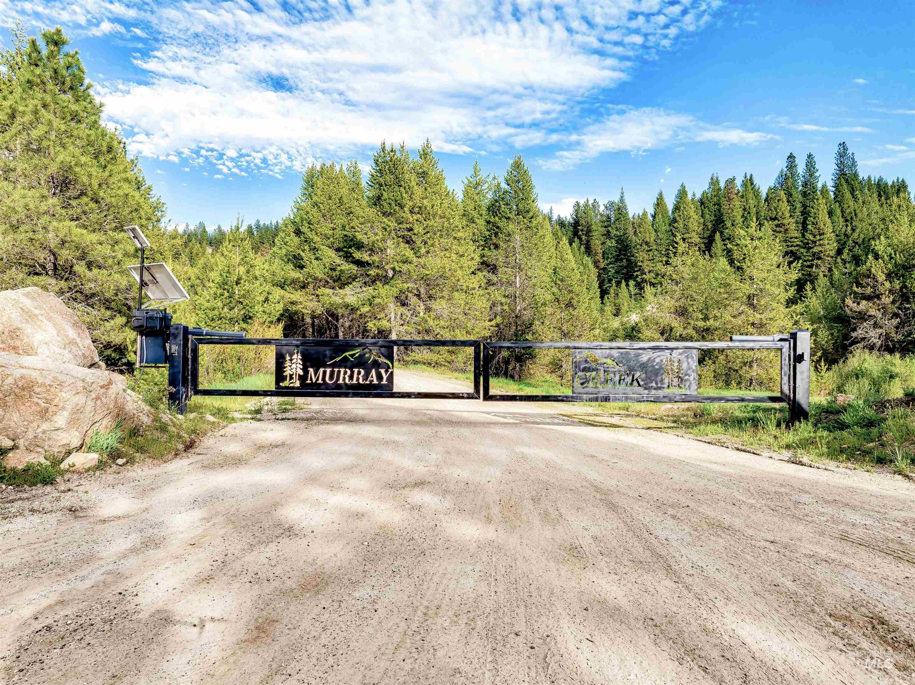 201 Tripod View Cascade, ID 83611 - Photo 32 of 41 Gate featuring a view of trees