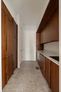 a utility room with wooden floor washer and dryer