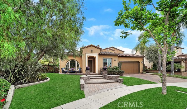 21 Christopher Street Ladera Ranch, CA 92694 - Photo 1 of 1 a front view of a house with a garden and plants