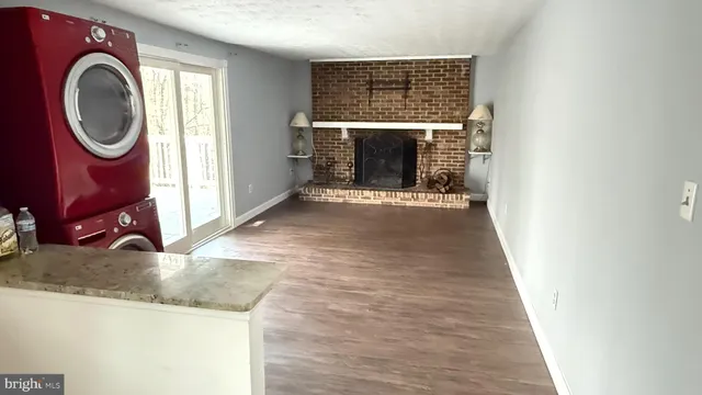 a kitchen with stainless steel appliances a refrigerator and a stove top oven