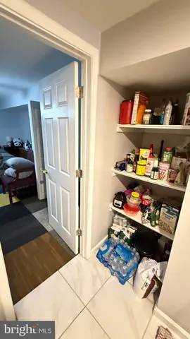 a utility room with window and shelf