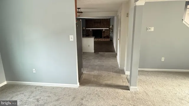 a view of a kitchen with a sink and a stove top oven