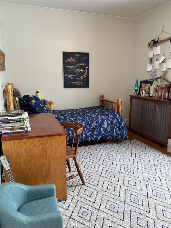 142 Sanders Avenue Lowell, MA 01851 - Photo 20 of 28 a living room with a couch and a dining table