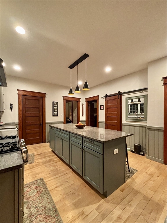 142 Sanders Avenue Lowell, MA 01851 - Photo 5 of 28 a kitchen with stainless steel appliances granite countertop a stove and a sink