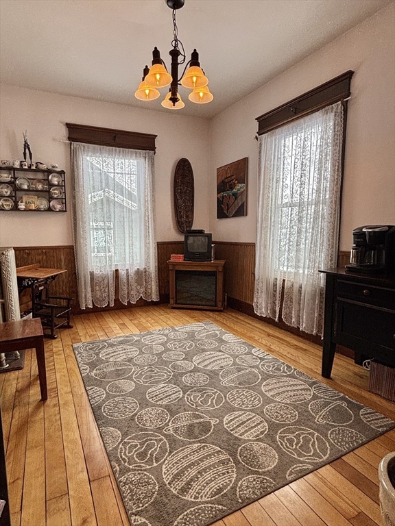 142 Sanders Avenue Lowell, MA 01851 - Photo 8 of 28 a bedroom with a bed and wooden floor