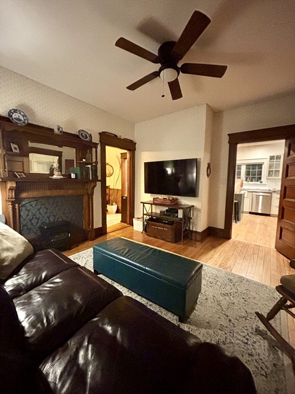 142 Sanders Avenue Lowell, MA 01851 - Photo 10 of 28 a living room with fireplace furniture and a flat screen tv