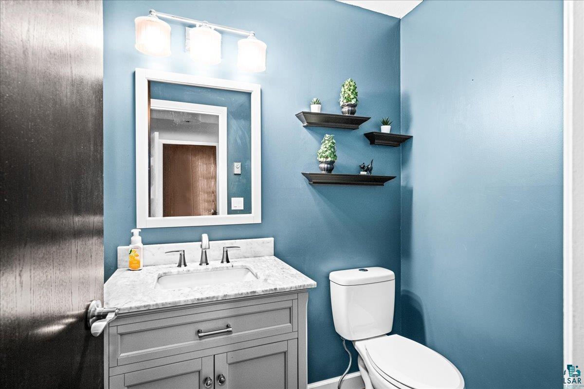 2524 Providence Road Duluth, MN 55811 - Photo 14 of 42 Bathroom with toilet and vanity