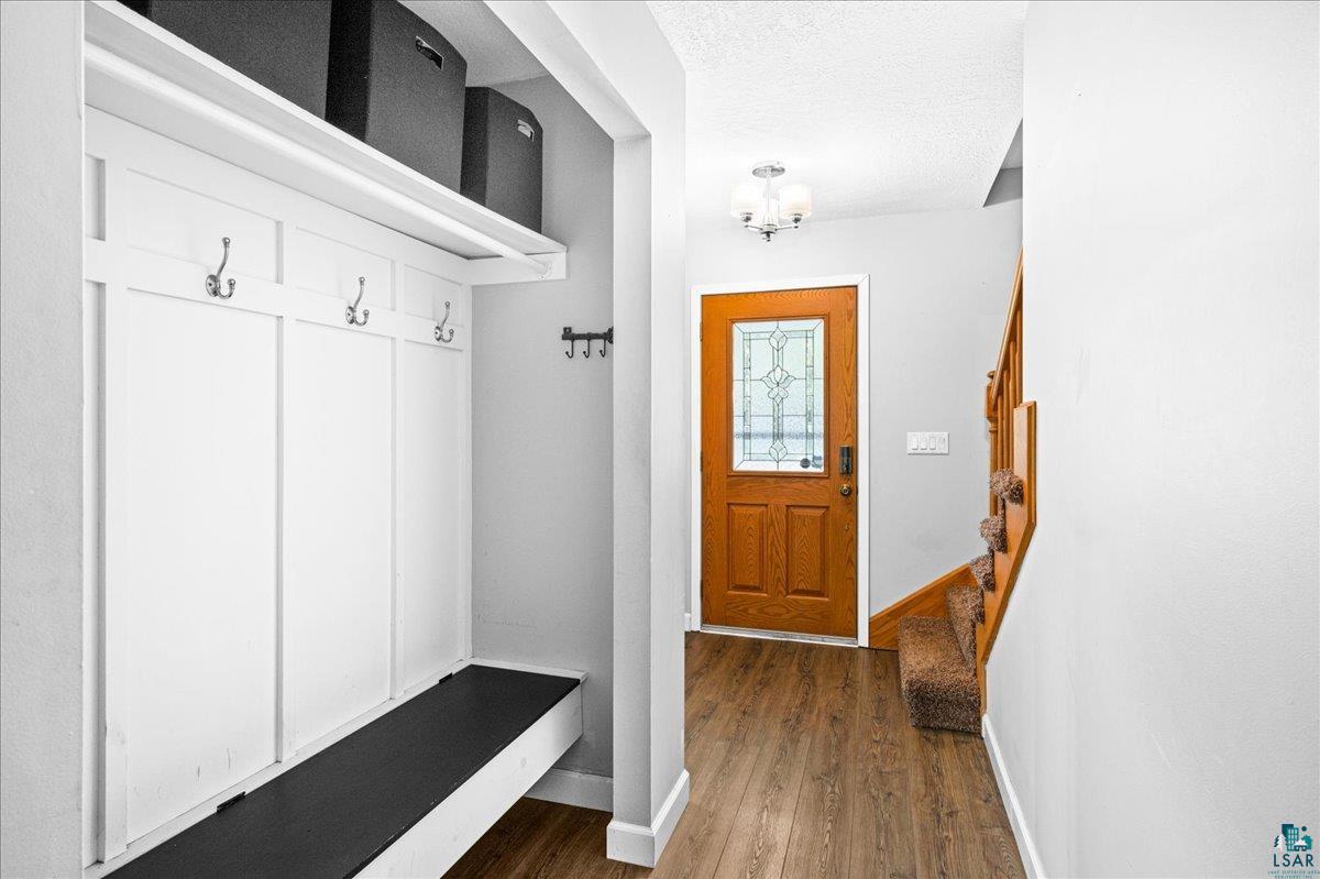 2524 Providence Road Duluth, MN 55811 - Photo 15 of 42 Mudroom with a textured ceiling and dark hardwood / wood-style floors