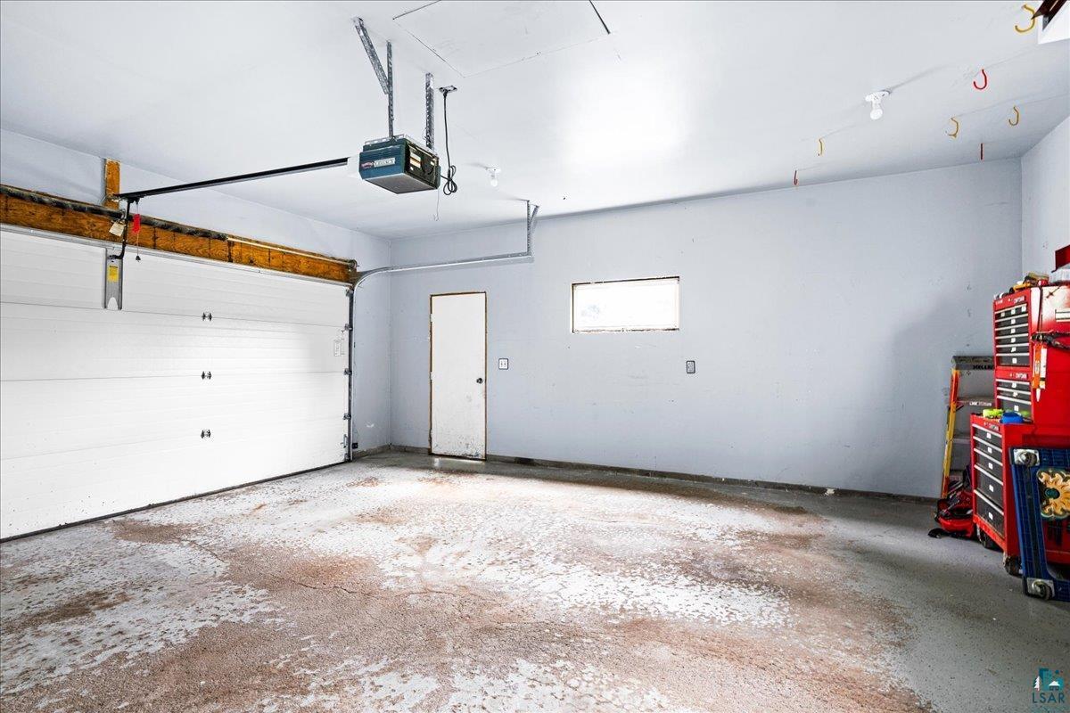2524 Providence Road Duluth, MN 55811 - Photo 30 of 42 Garage featuring a garage door opener