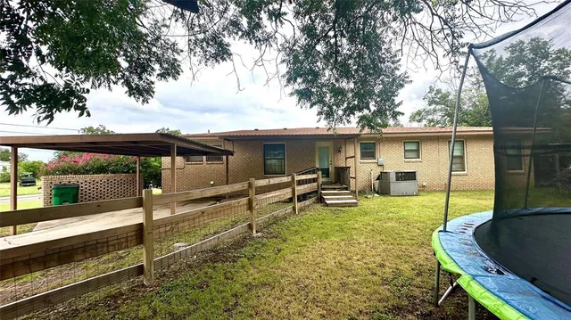 a backyard of a house with seating space