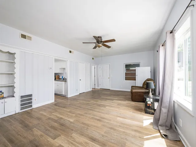 a view of work space with wooden floor and a window