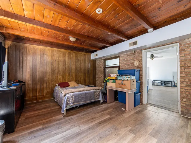 a bed room with a bed and furniture