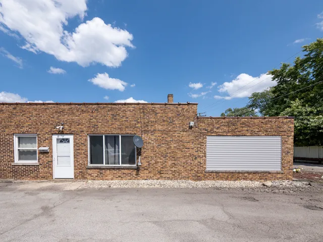 front view of a house with a road