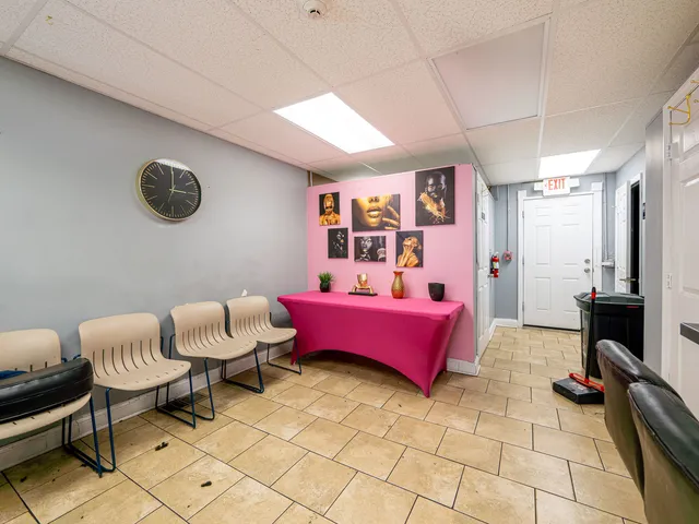 a bedroom with furniture and a window