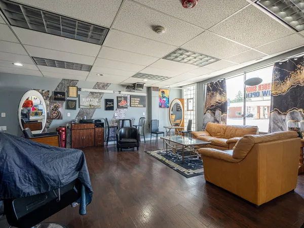 a living room with furniture and a chandelier