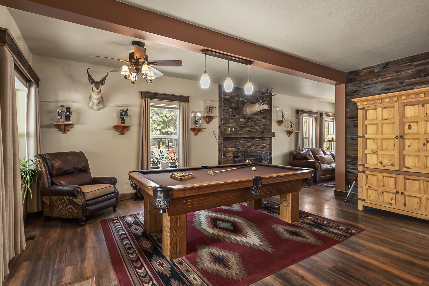 15730 Jackpine Road La Pine, OR 97739 - Photo 10 of 43 a living room with fireplace furniture and wooden floor