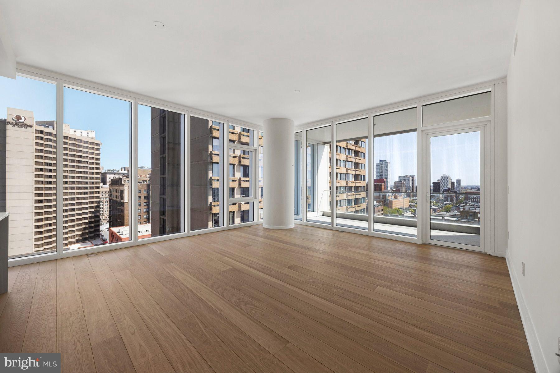 301 South Broad Street, Unit 1902 Philadelphia, PA 19107 - Photo 12 of 44 wooden floor in an empty room with a window