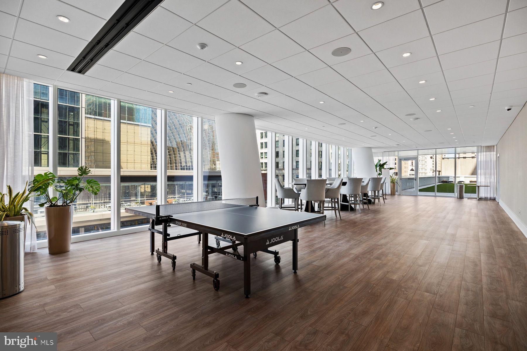 301 South Broad Street, Unit 1902 Philadelphia, PA 19107 - Photo 43 of 44 a dining room with furniture window and wooden floor