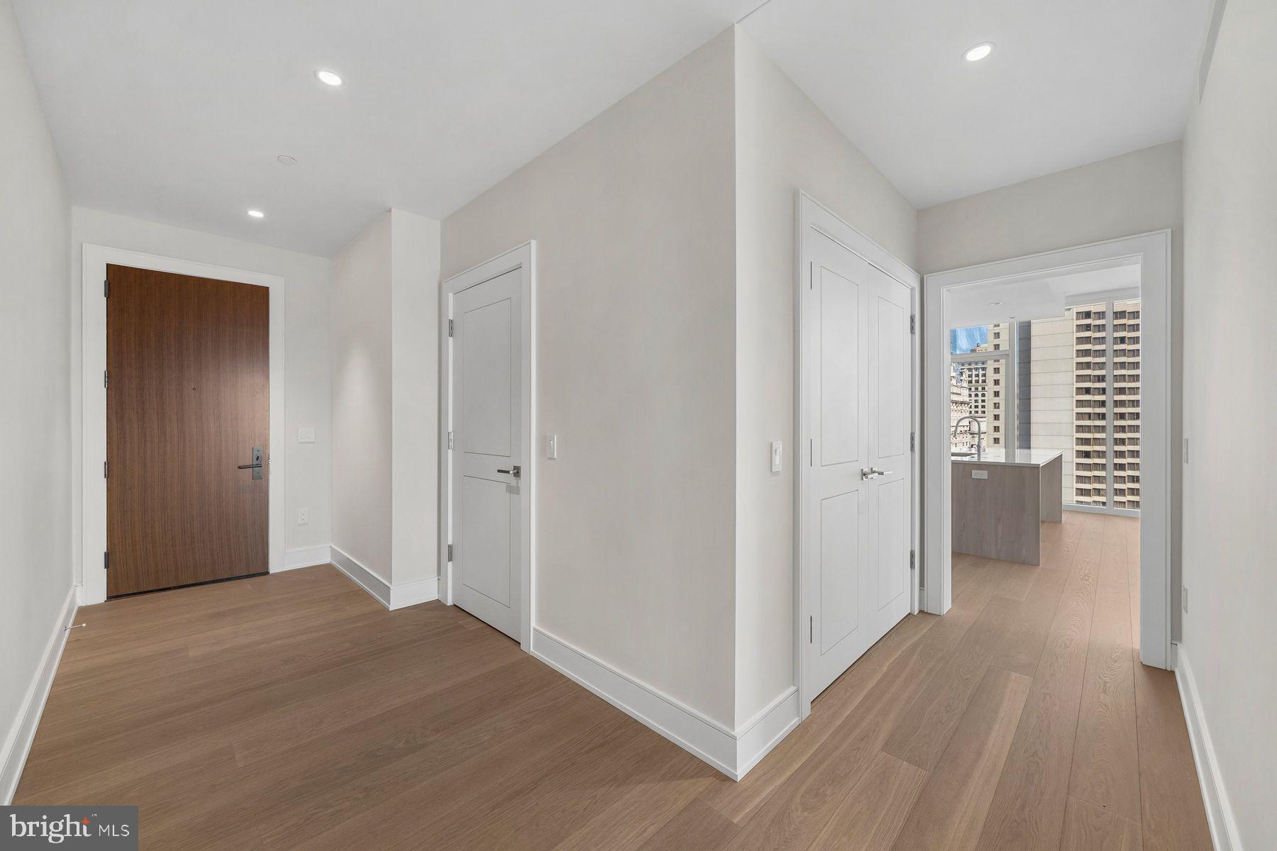 301 South Broad Street, Unit 1902 Philadelphia, PA 19107 - Photo 5 of 44 a view of hallway with wooden floor