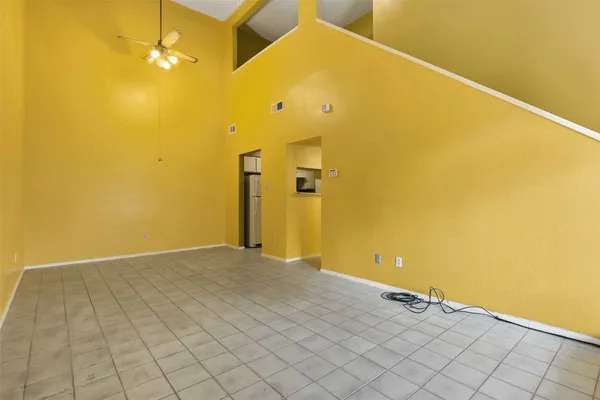 a view of a big room with windows