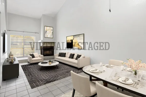 a living room with furniture fireplace and a flat screen tv